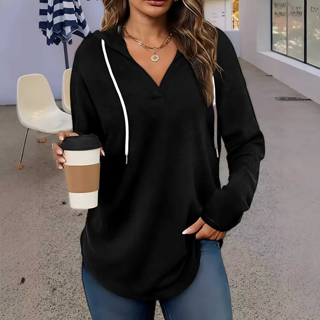 Red women's v-neck hooded sweatshirt with long sleeves on a hanger, loose fit.