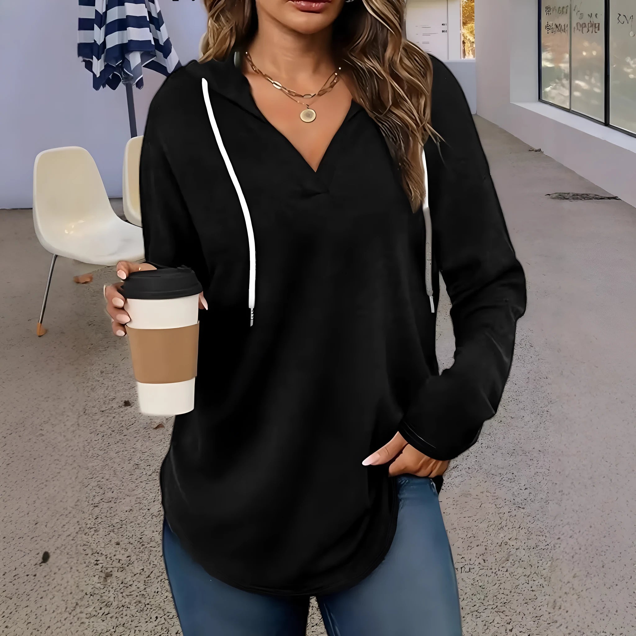 Red women's v-neck hooded sweatshirt with long sleeves on a hanger, loose fit.