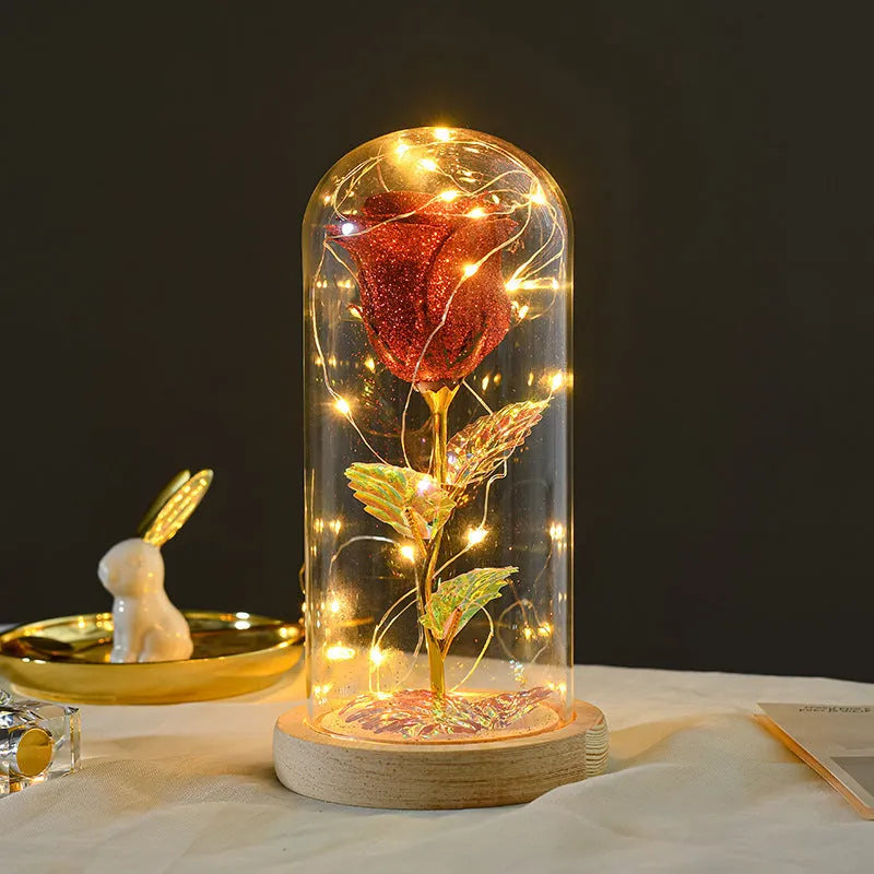 Eternal rose flower LED light in glass cover with warm white glow, six colours available, handmade
