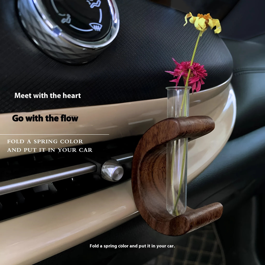 Wooden C-shaped car flower container in Beech finish on a car air vent