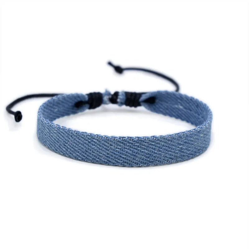 Denim fabric bracelet carrying strap with mixed materials, unisex design for travel
