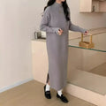 Women's knitted half turtleneck dress in acrylic with long sleeves and a high-waisted midi skirt.