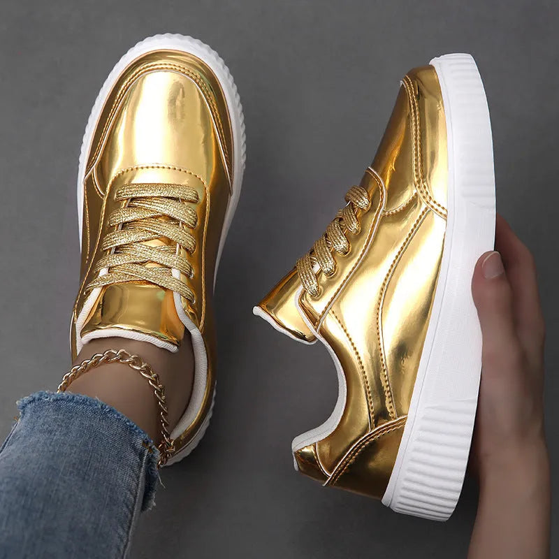 Thick-soled sequin sneakers in metallic rose gold with platform heel and round toe