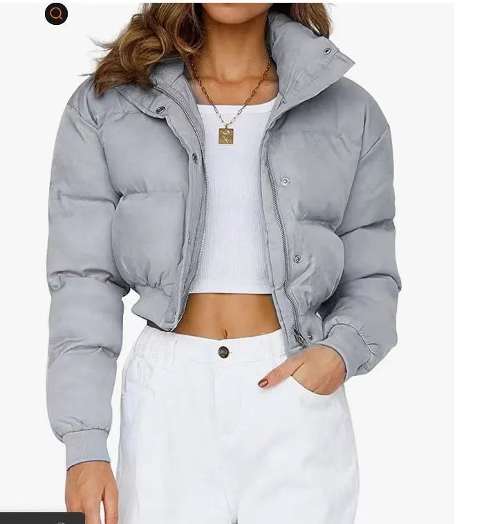 Women's loose blue polyester casual jacket with long sleeves on a hanger.