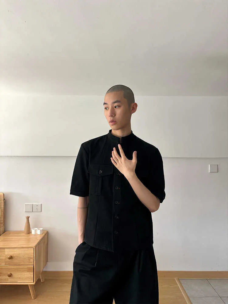 Black loose fit hunting shirt with half sleeves, shirt collar, and single-breasted placket