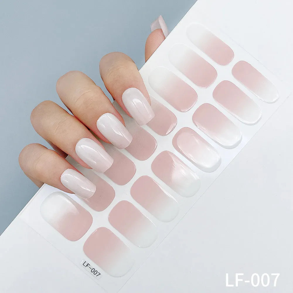 Set of 16 solid colour full nail art stickers showing patterns like cross, rose, tulip, and cartoon designs.