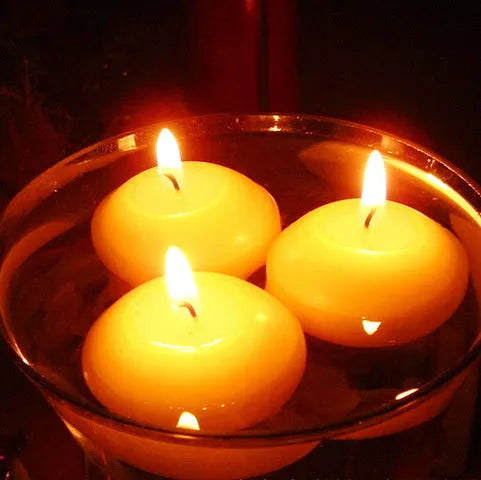 Ivory white cylindrical floating candles made of paraffin wax in a 10 pack for wedding decor