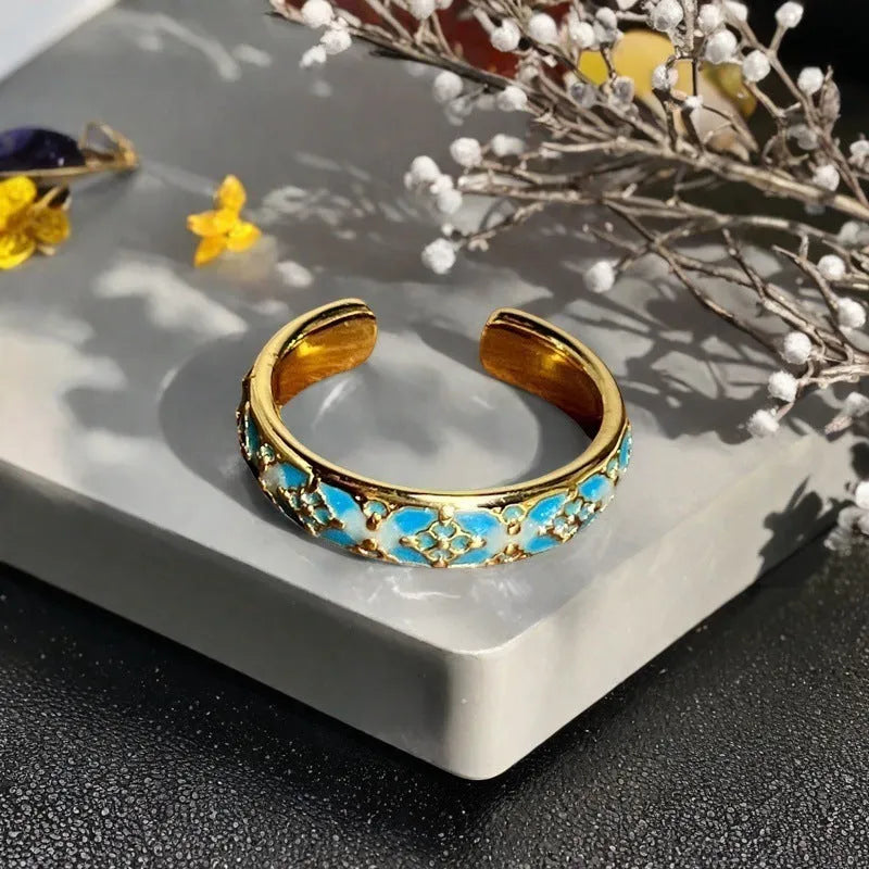Adjustable gourd vintage ring with oil dripping finish in New Chinese style showing bow-shaped elements and zircon details