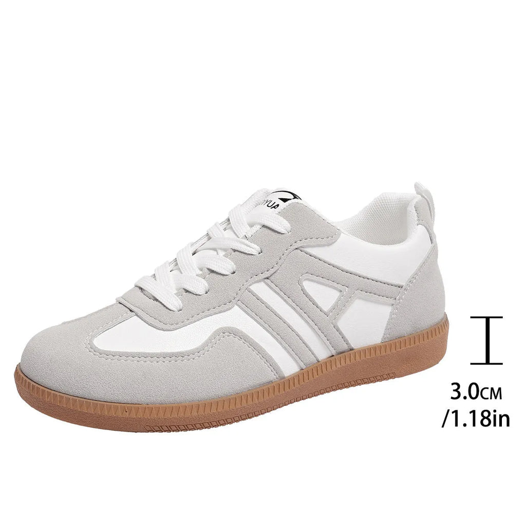 Women's retro colour matching lace-up trainers in black, grey or khaki with low heel platform and cross strap details