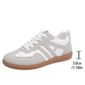 Women's retro colour matching lace-up trainers in black, grey or khaki with low heel platform and cross strap details