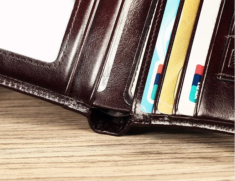 Men's leather wallet showing internal compartments for cards, cash, coins and documents
