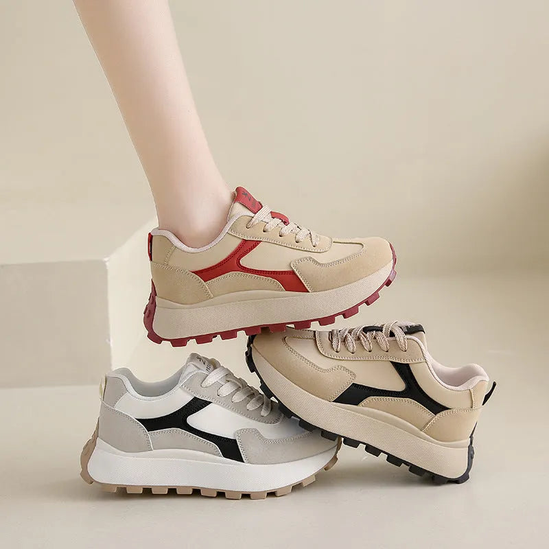 Women's low-top platform running shoes in black, red, or grey with lace-up front and flat rubber sole.