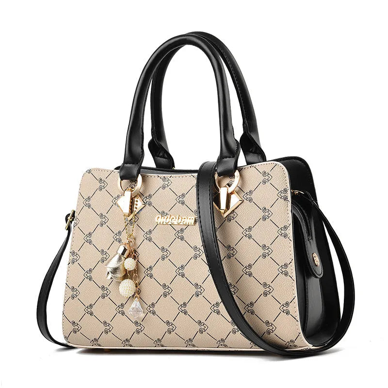 Women's geometric pattern print messenger bag in PU leather with zipper closure and internal organisers.
