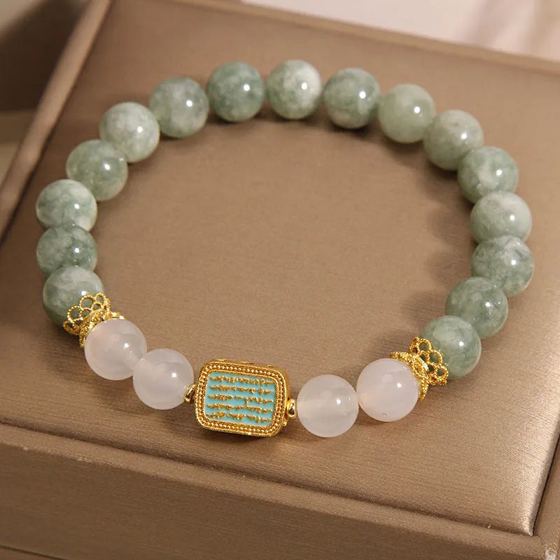 Women's oil green emerald crystal bracelet with five scripture bead design on wrist