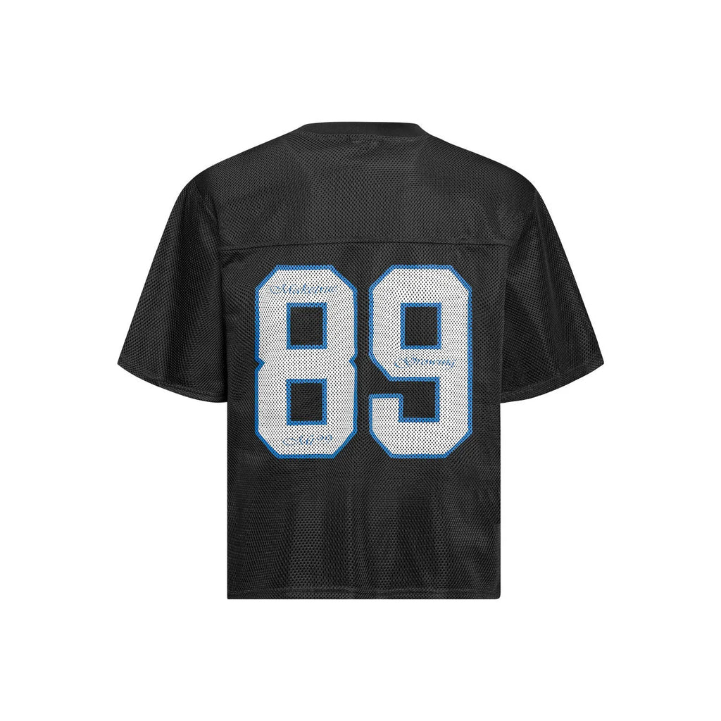 Black loose-fit t-shirt with white alphanumeric graphic print on the front.