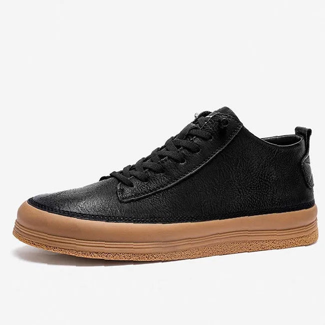 Men's black leather casual shoes with round toe and flat rubber sole on a white background.
