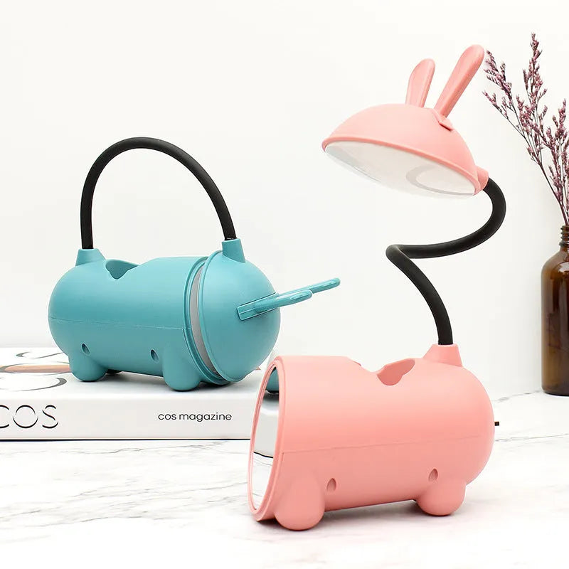 Cartoon-style desktop table lamp with pen container in green, dark blue, or pink colours