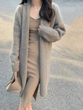Women's mid-length knitted cardigan with V-neck and long sleeves in loose fit