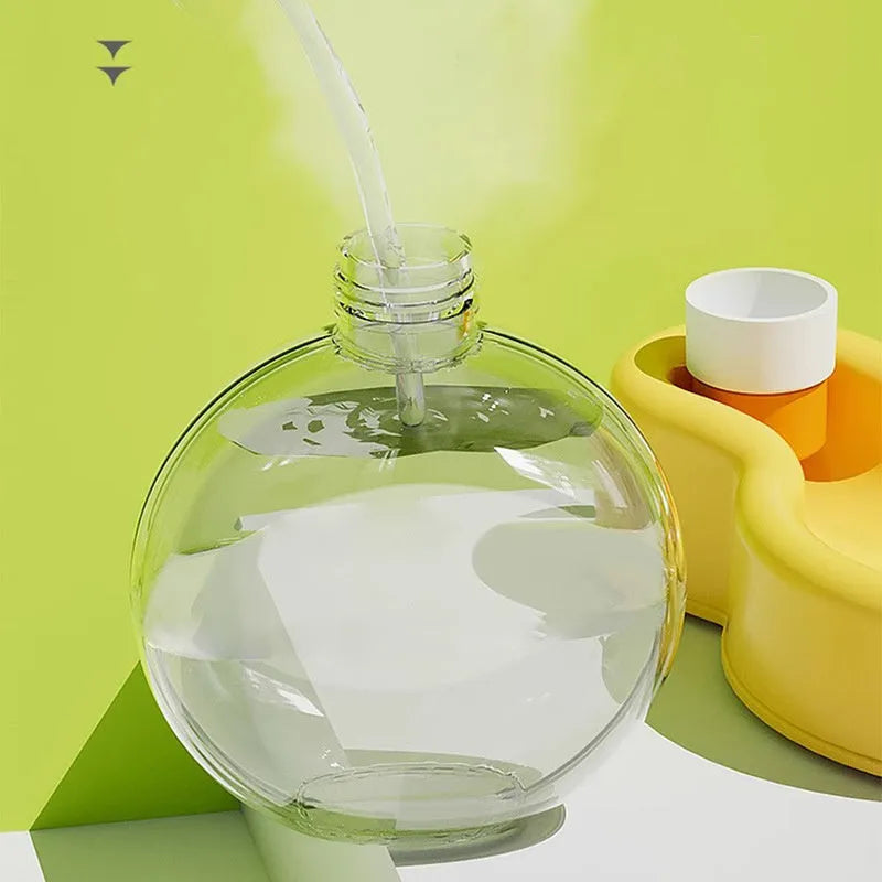 Green portable dog water bottle with pull-out drinking bowl for outdoor travel and camping.