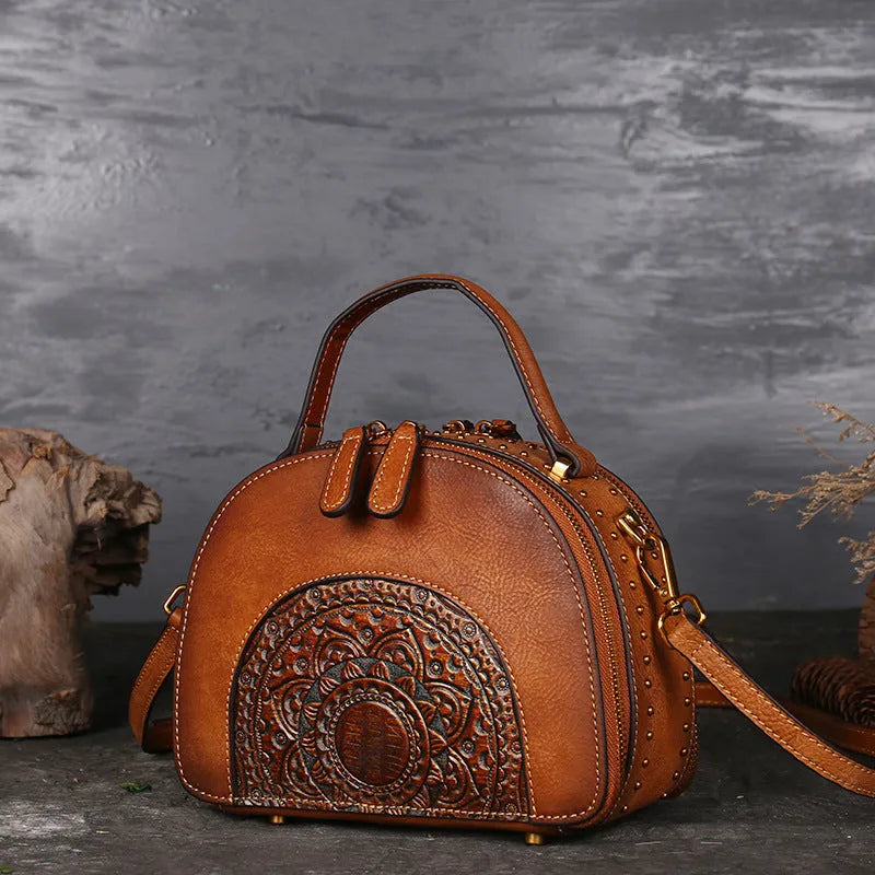 Vintage-style suede cowhide leather handbag with multiple internal organisation pockets.