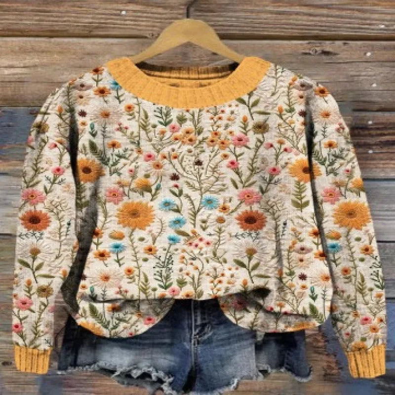 Little flower digital print on a round neck polyester sweater, shown on a hanger.