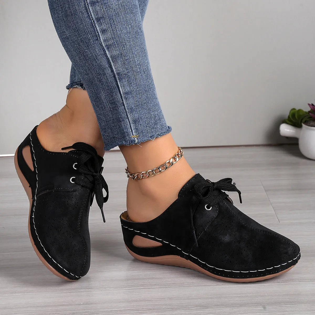 Women's lace-up Baotou slippers with hollow-out wedge design in suede material, available in multiple colours.