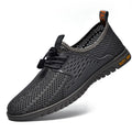 Men's black mesh casual sports shoes with elastic band and rubber sole.
