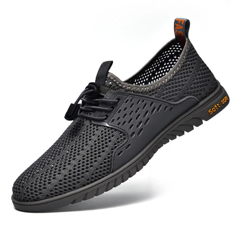 Men's black mesh casual sports shoes with elastic band and rubber sole.
