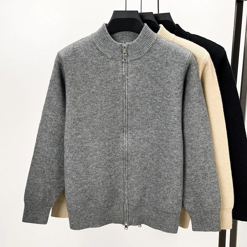 Men's black stand collar cardigan with front zipper showing loose fit and thickened knit construction