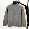 Men's black stand collar cardigan with front zipper showing loose fit and thickened knit construction