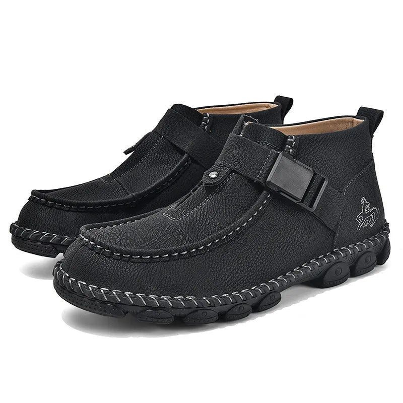 Men's black casual slip-on shoes with handmade stitching on the synthetic leather upper and a flat sole.