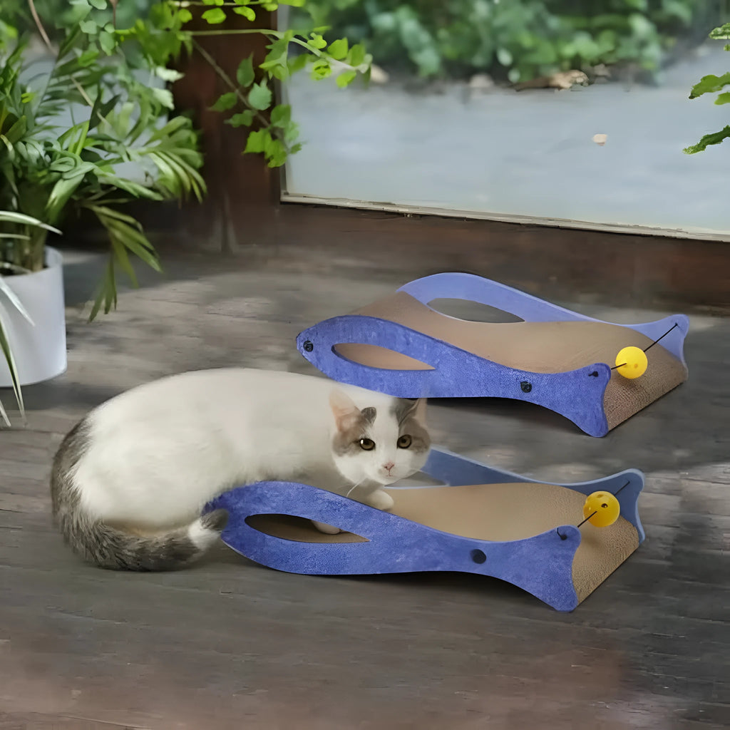 Blue fish-shaped cat scratcher pad with wavy design and hanging bell ball toy