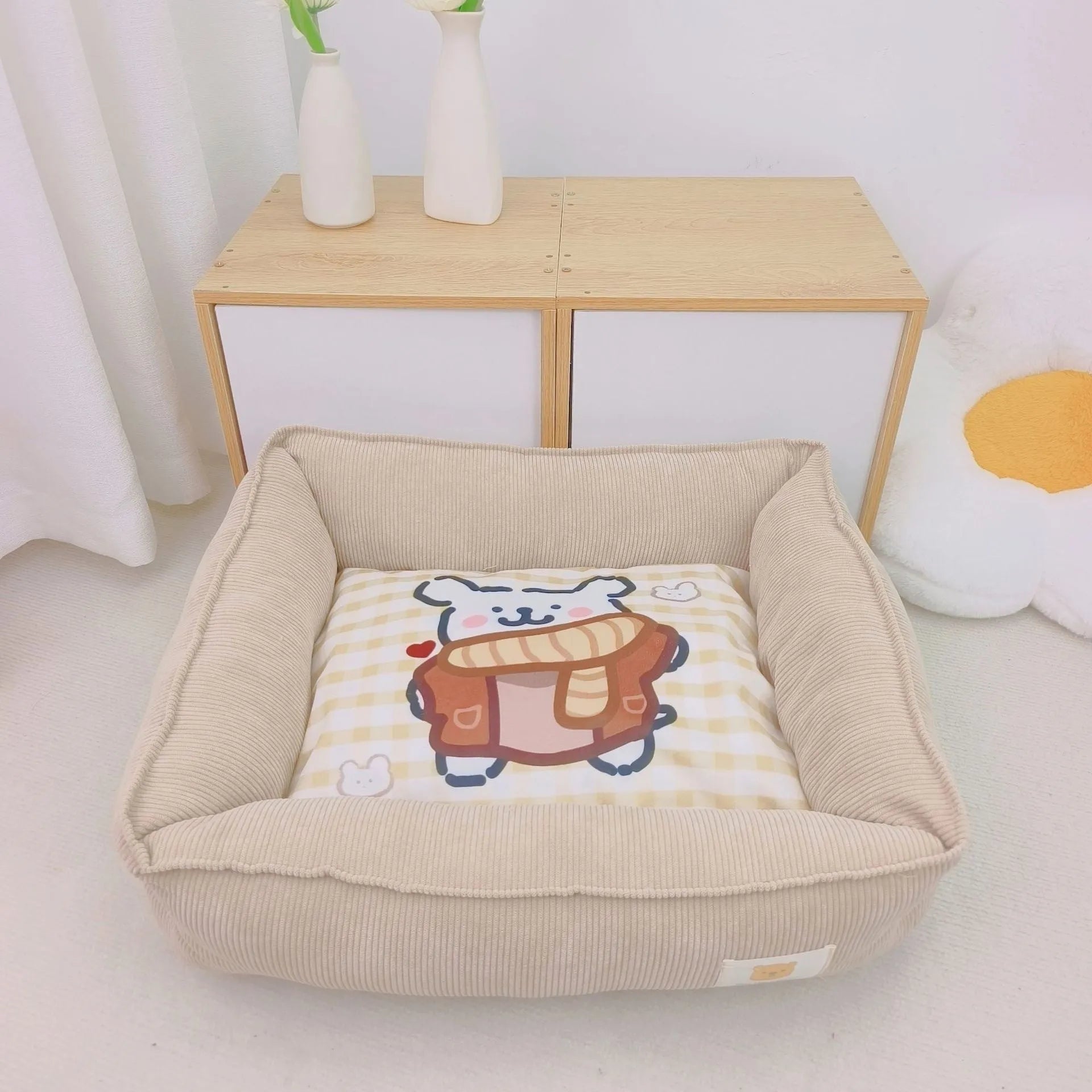 Light blue washable cotton pet winter nest for dogs and cats on a floor.