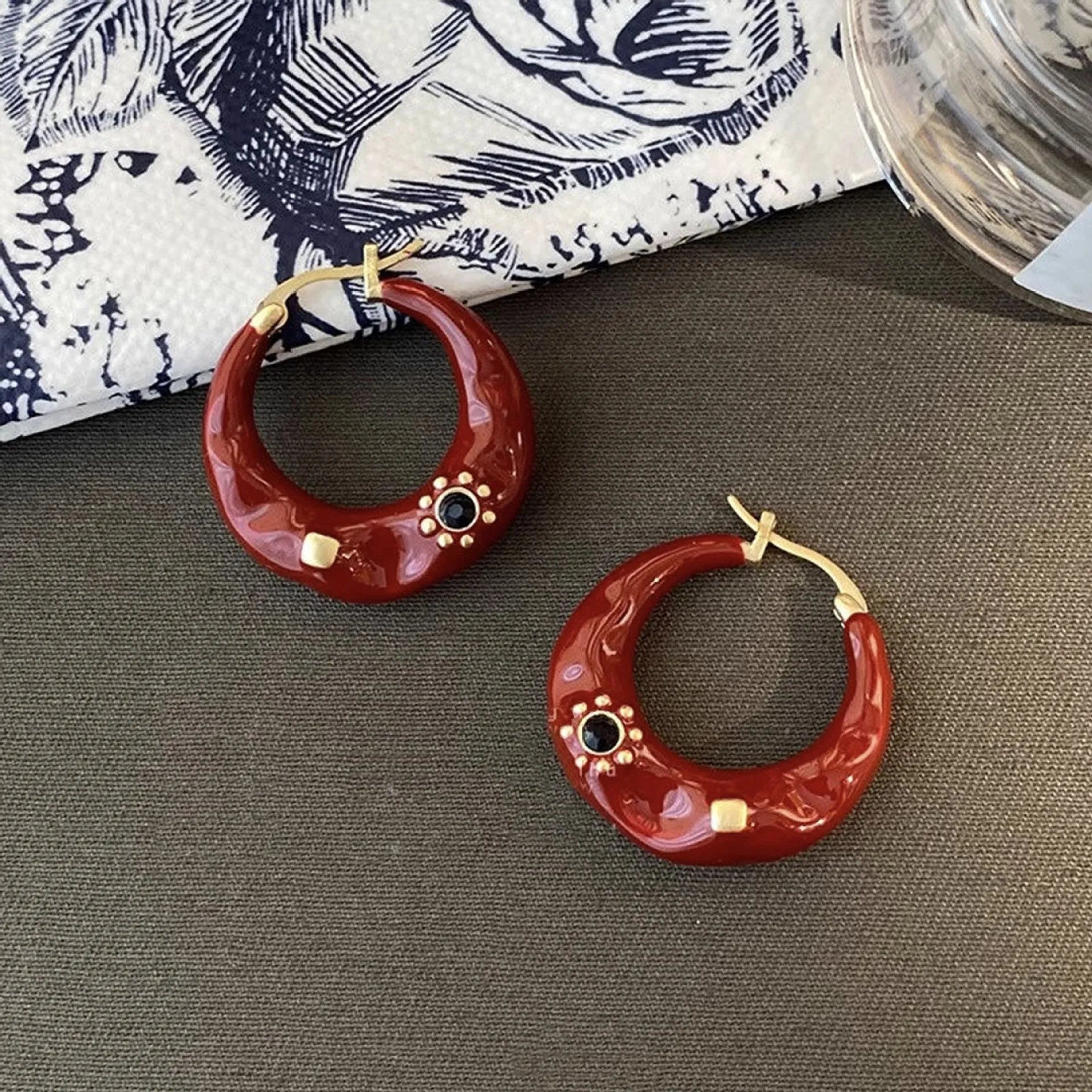 Hong Kong style retro ear studs with dripping oil finish and rhinestone inlay in black and red colours