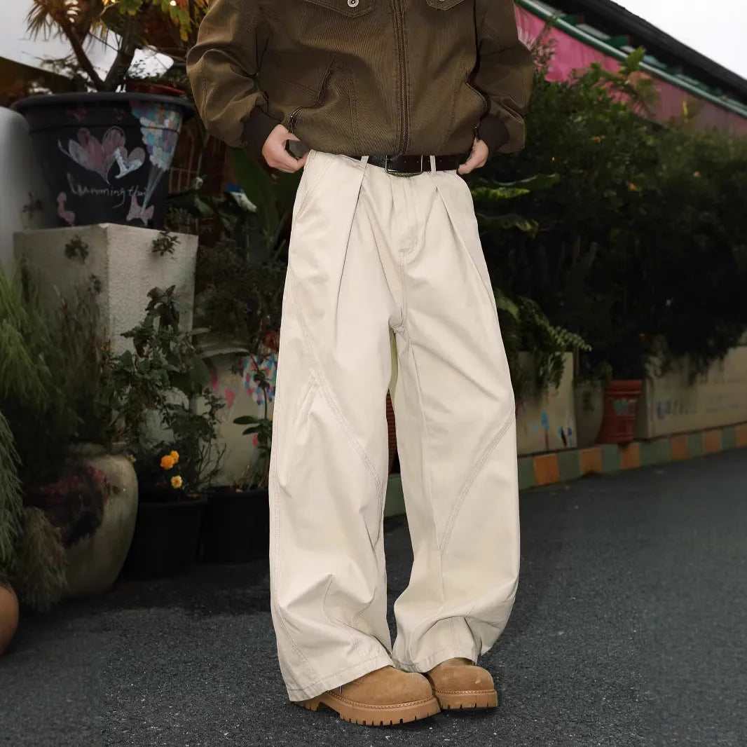 Men's pleated straight loose trousers in black striped pattern showing straight leg design
