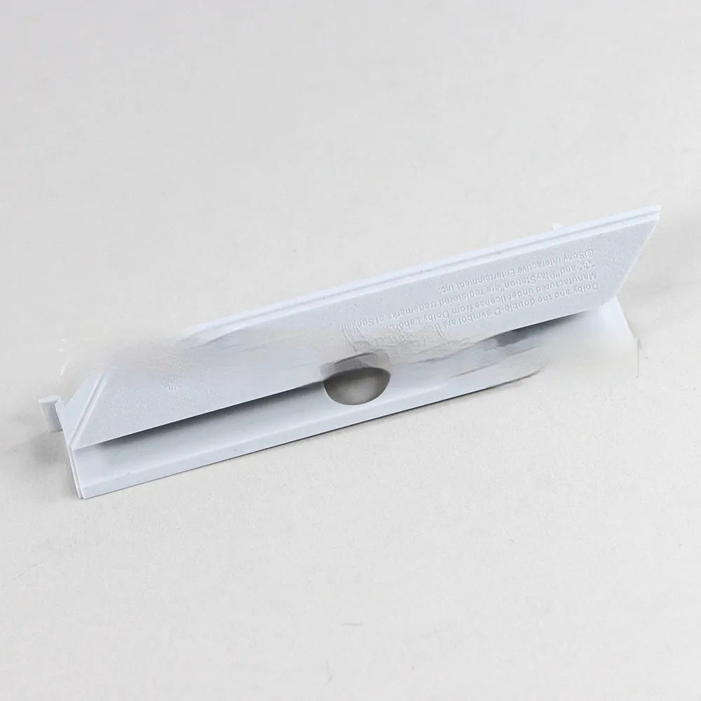 Black and white plastic hard disk baffle cover for 3.5-inch internal drive bays.