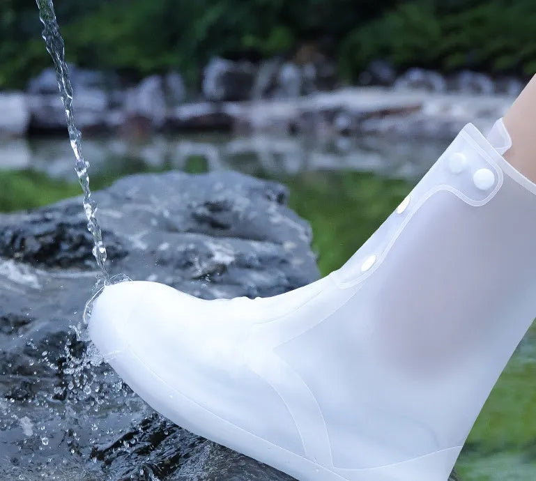 White high-top PVC reusable waterproof shoe covers for women with size chart showing measurements