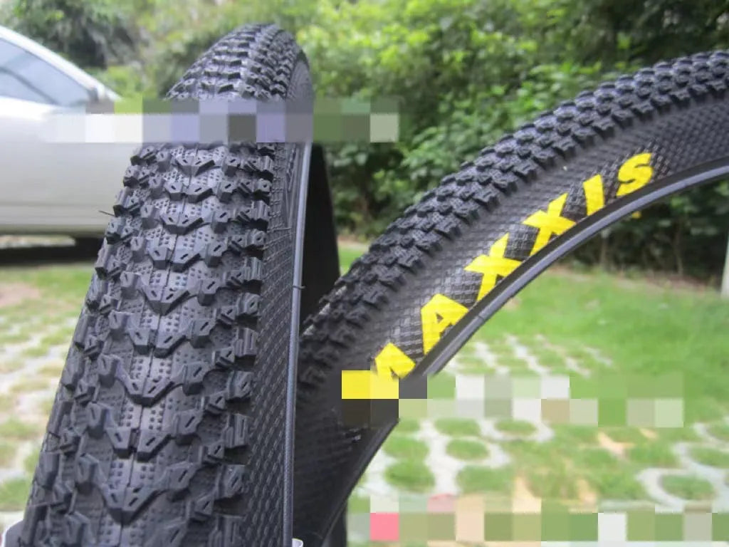 Ultralight puncture-resistant mountain bike tyre showing tread pattern and available sizes