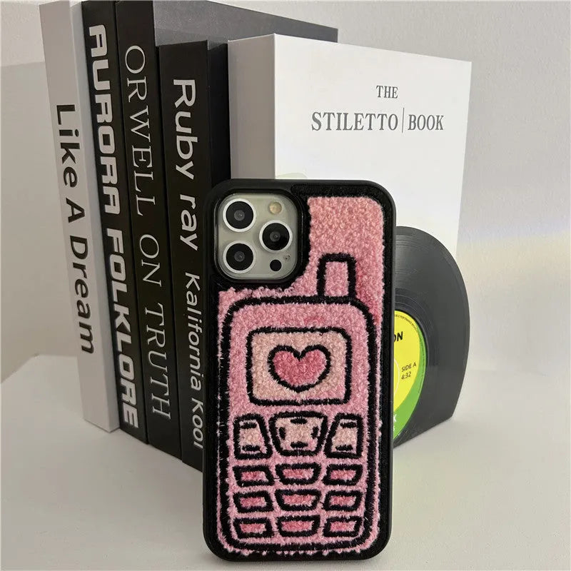 Pink towel embroidered TPU iPhone case showing textured surface on back cover.