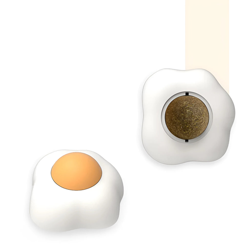 Interactive catnip ball toy with soft plush exterior mounted on wall surface