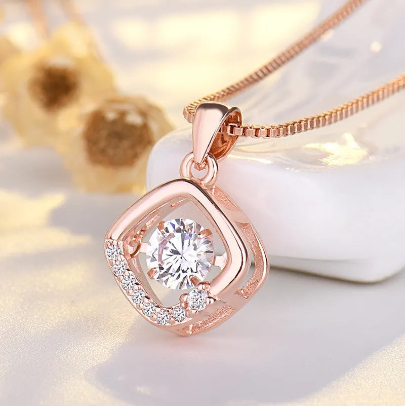 Sterling silver heart necklace with crown and bow charm detail in rose gold or silver finish