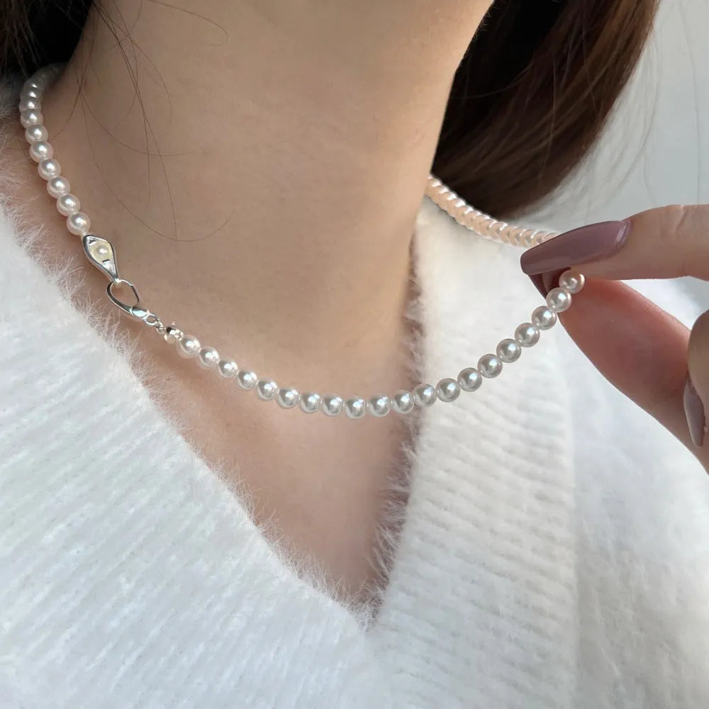 Women's sterling silver necklace with a pearl pendant on silver chain