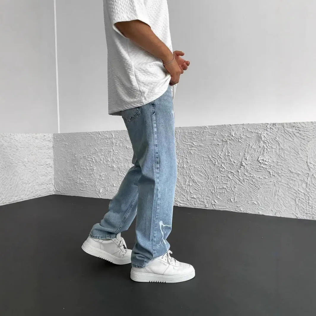 Men's straight-leg denim jeans in medium wash blue with zipper fly and mid-waist design