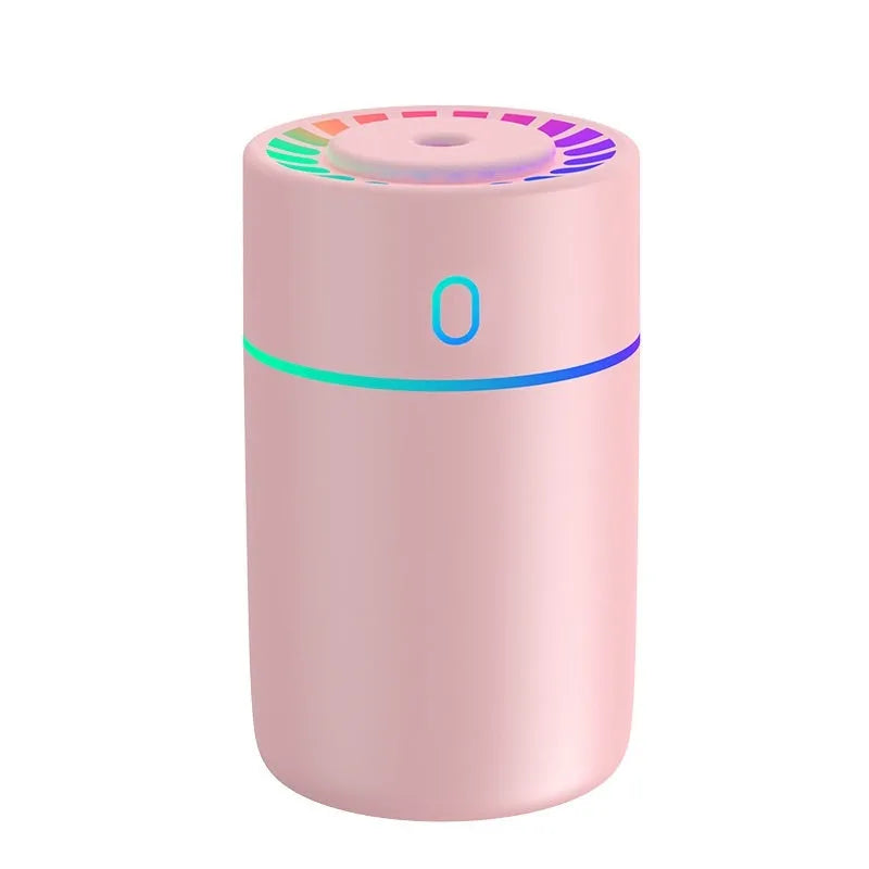 Round plastic USB desktop humidifier in black, pink, and white with single fog outlet