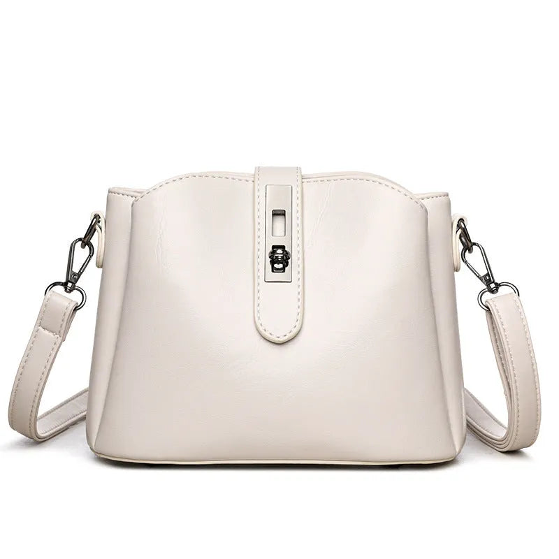 Retro women's messenger bag in PU material with medium hardness and sandwich pocket, available in white black brown