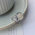 Adjustable copper ring with imitation white chalcedony stone and vintage styling