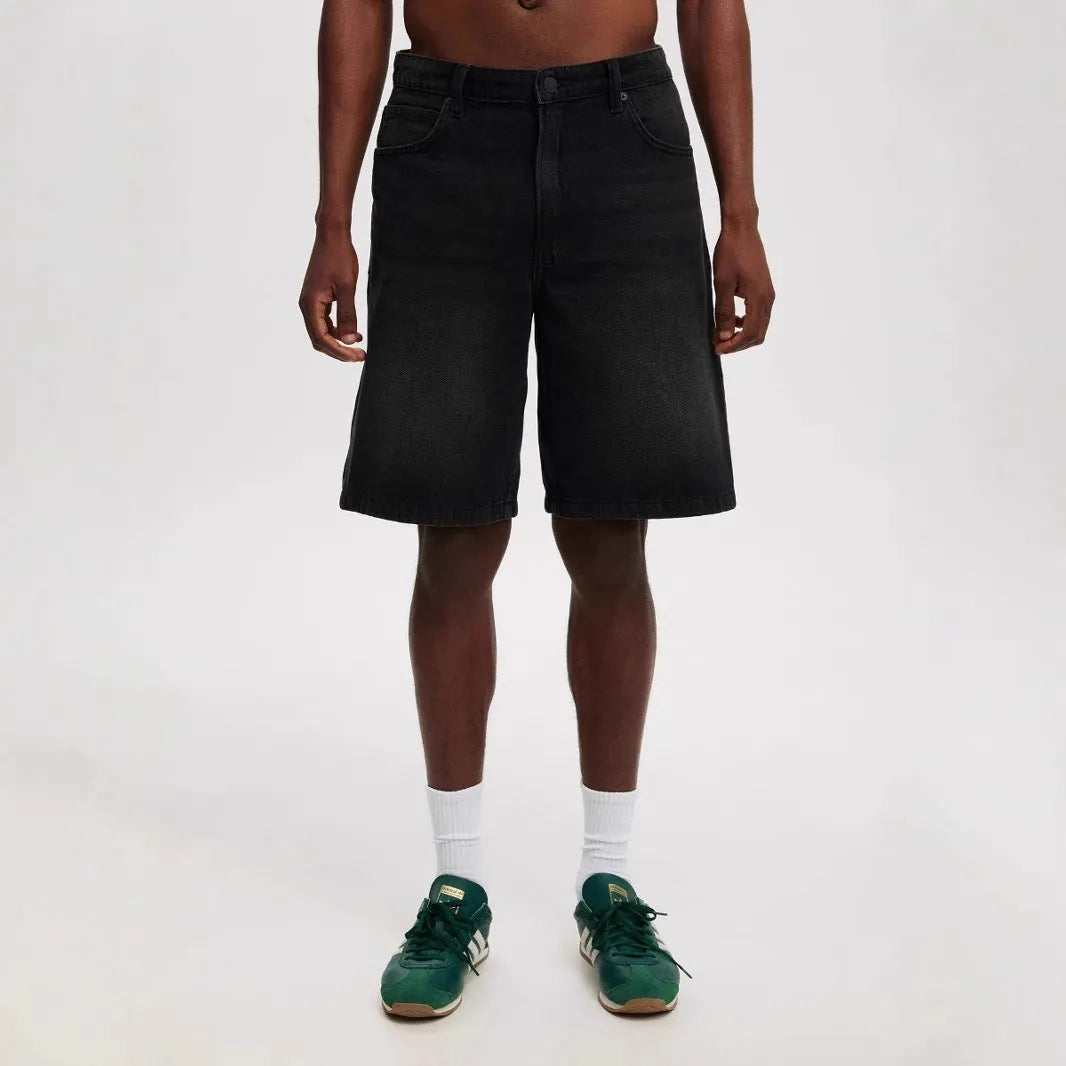 Men's loose straight-leg cotton jeans in light blue, black, or grey colour options.