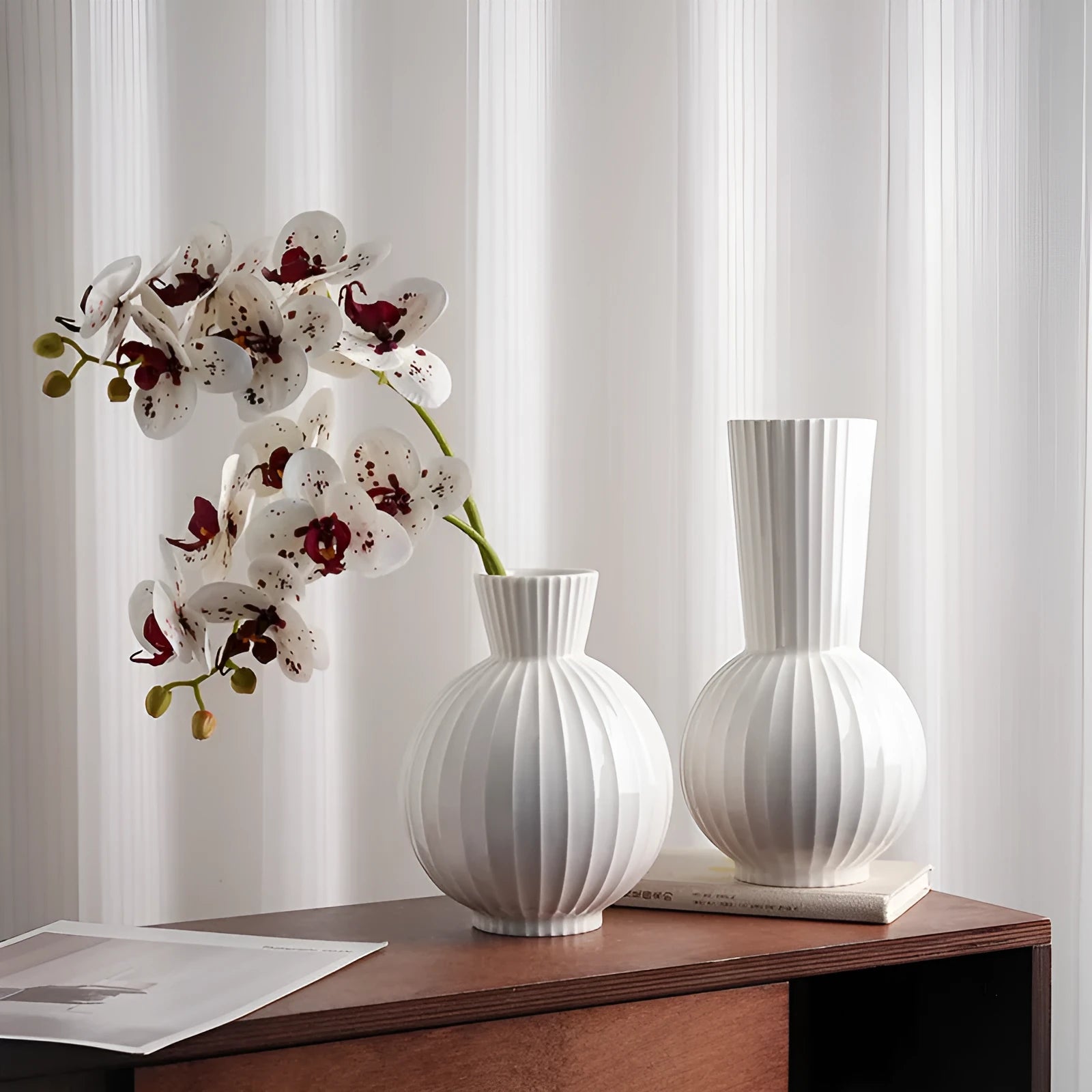 White ceramic ball vase with striped patterning in American country style on wooden table