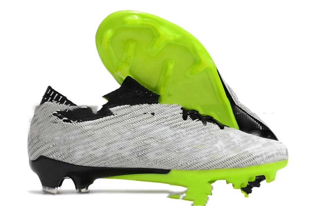 Men's knitted blue and white football shoes with FG studs and a lace-up front.
