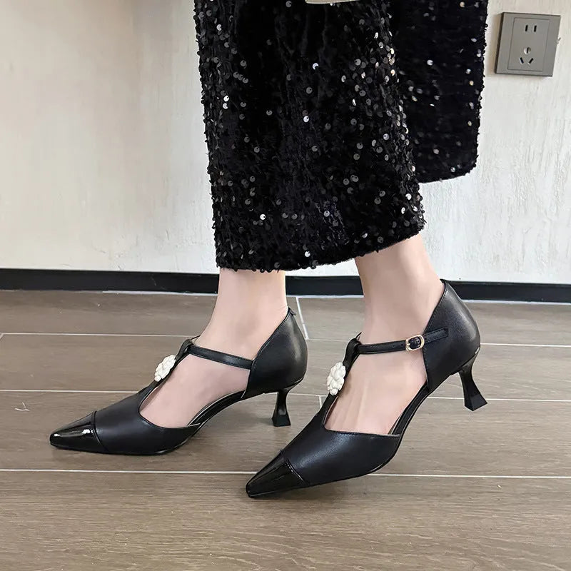 Gold women's stiletto heel shoe with floral buckle and pointed toe on a shallow 7-11cm cut.